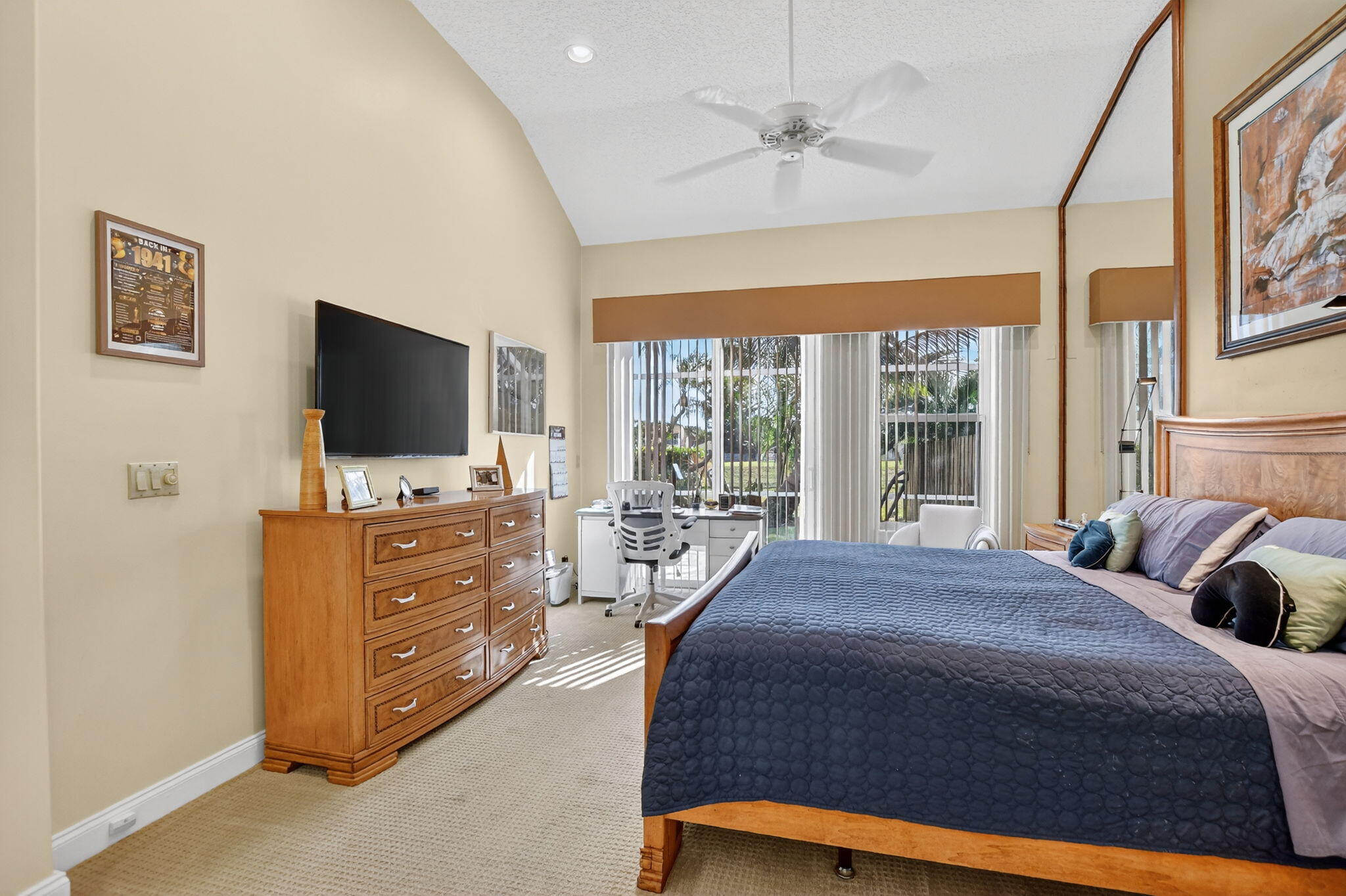 7816 Travelers Tree Drive Boca Raton, FL 33433 - Photo 24 of 61 a bedroom with a bed and a flat screen tv