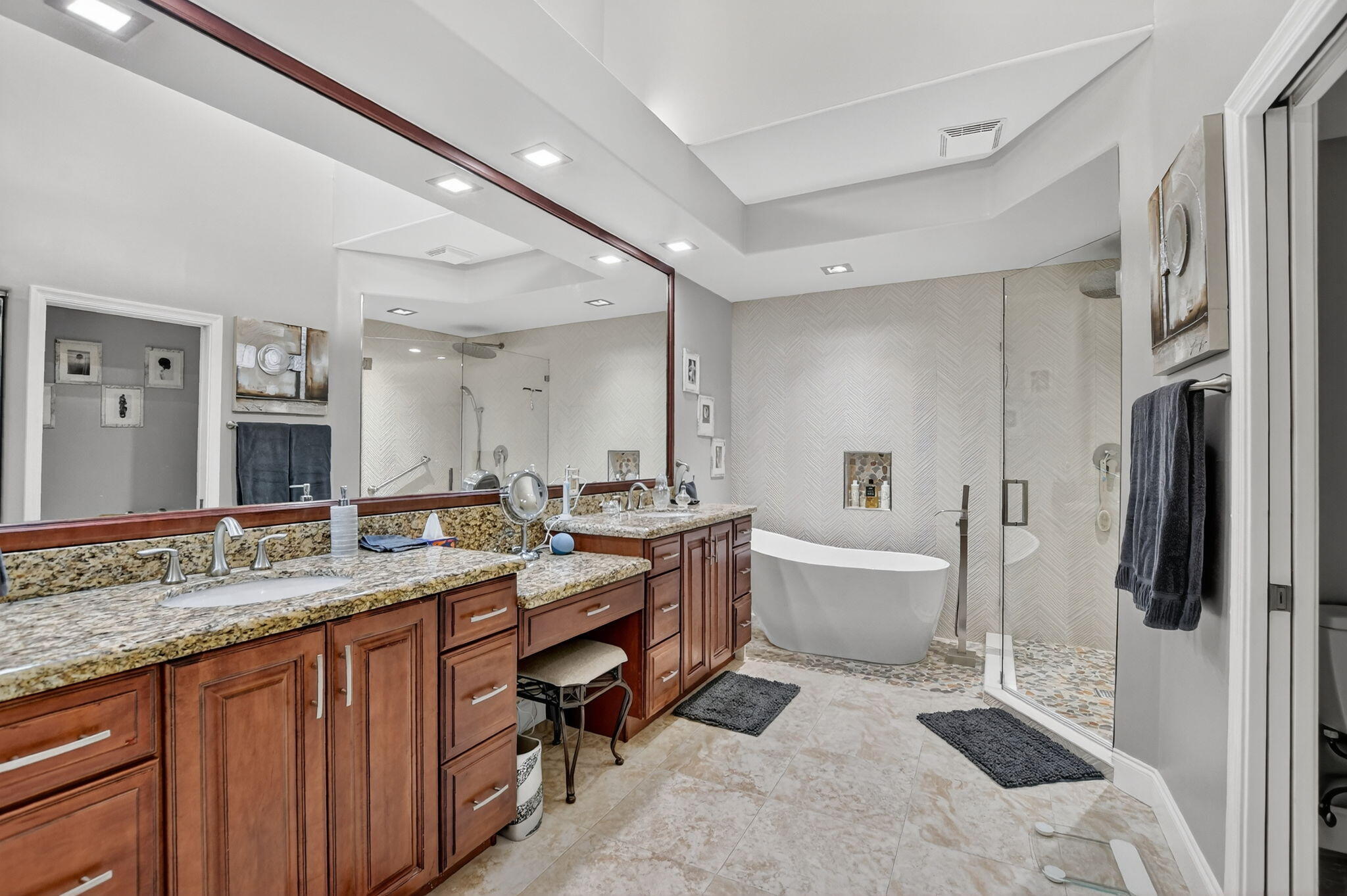7816 Travelers Tree Drive Boca Raton, FL 33433 - Photo 26 of 61 a spacious bathroom with a granite countertop sink and a mirror