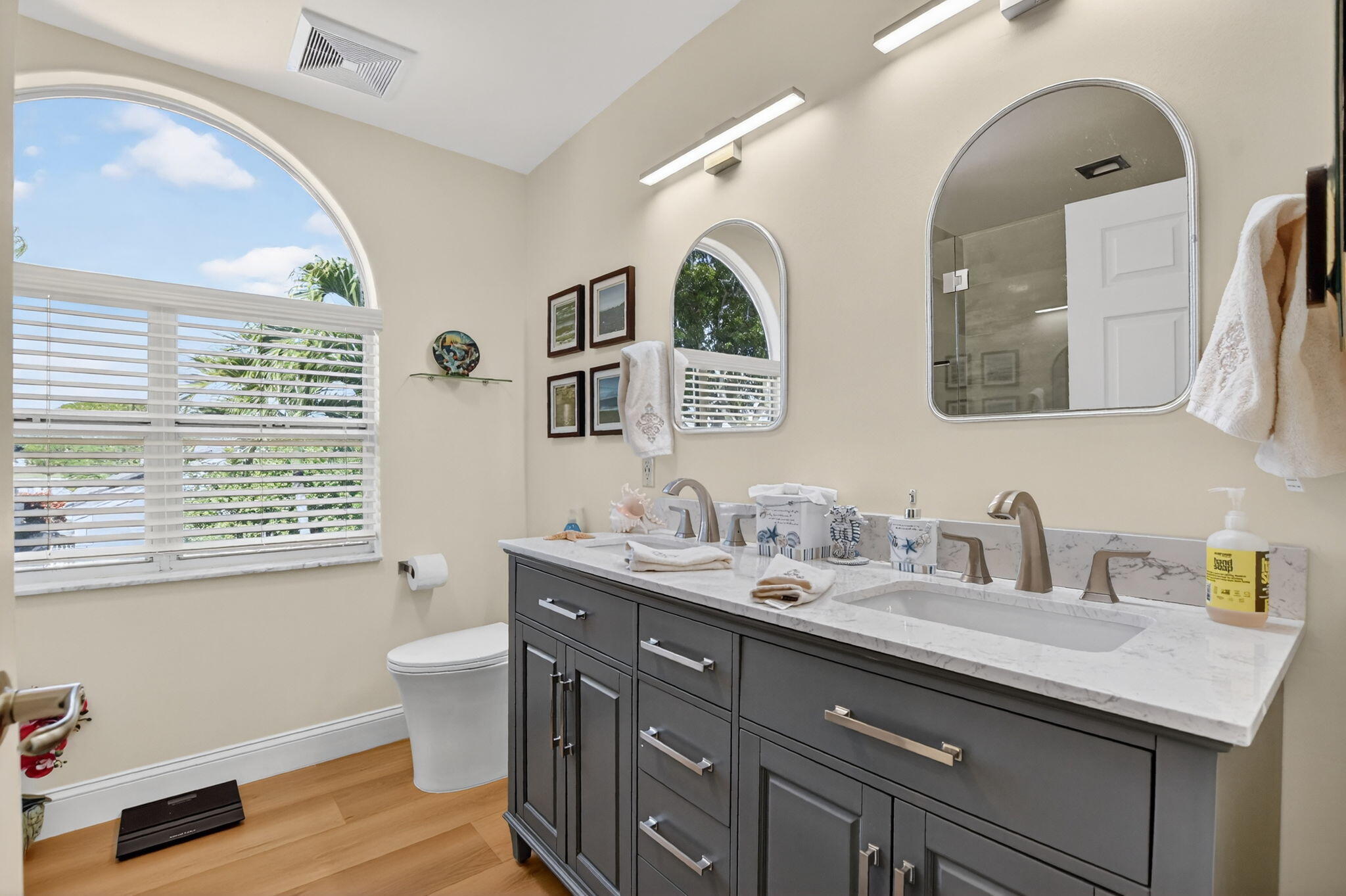 7816 Travelers Tree Drive Boca Raton, FL 33433 - Photo 33 of 61 a bathroom with a granite countertop double vanity sink a mirror and a window