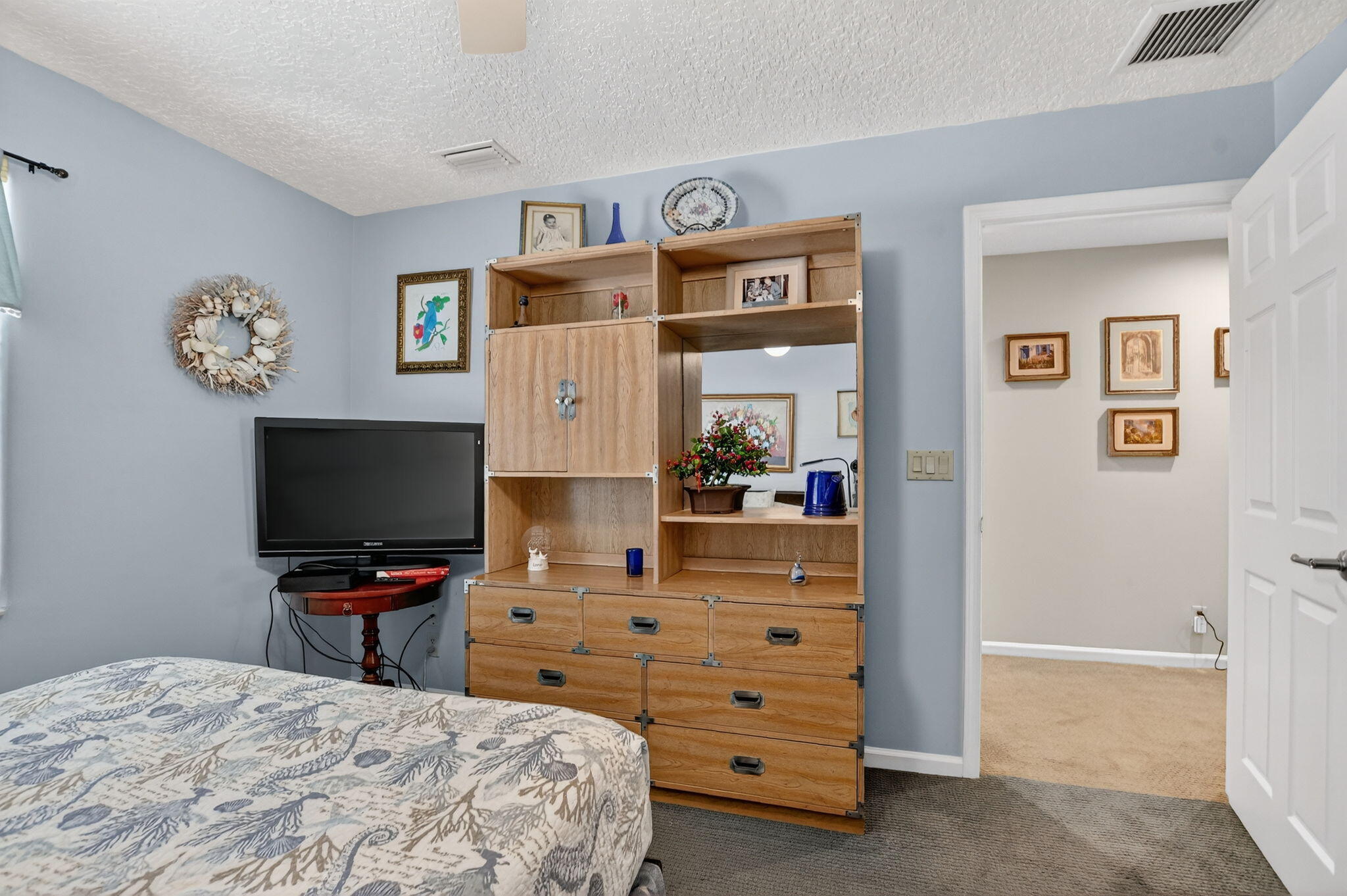 7816 Travelers Tree Drive Boca Raton, FL 33433 - Photo 38 of 61 a bedroom with a bed and a flat screen tv