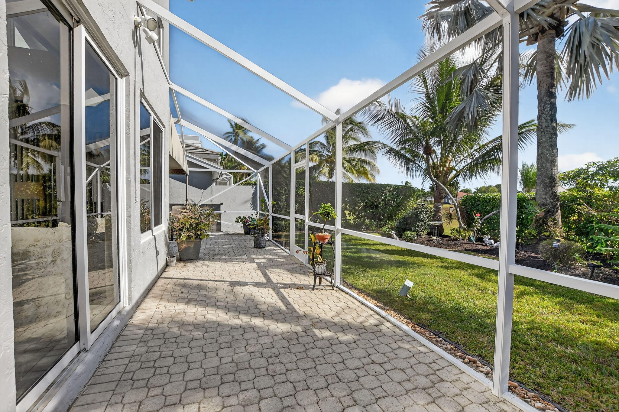 7816 Travelers Tree Drive Boca Raton, FL 33433 - Photo 40 of 61 a view of a patio with a yard