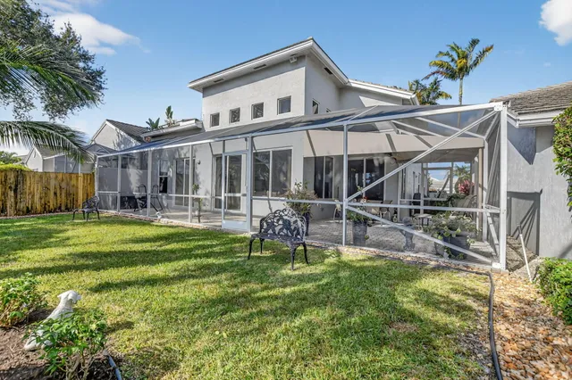 an aerial view of residential houses with outdoor space and swimming pool