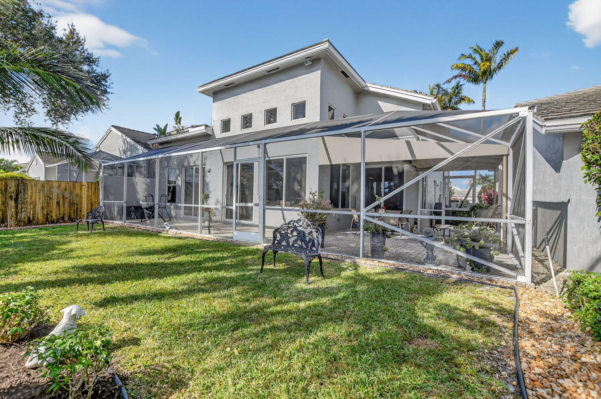 7816 Travelers Tree Drive Boca Raton, FL 33433 - Photo 49 of 61 a house view with a garden space
