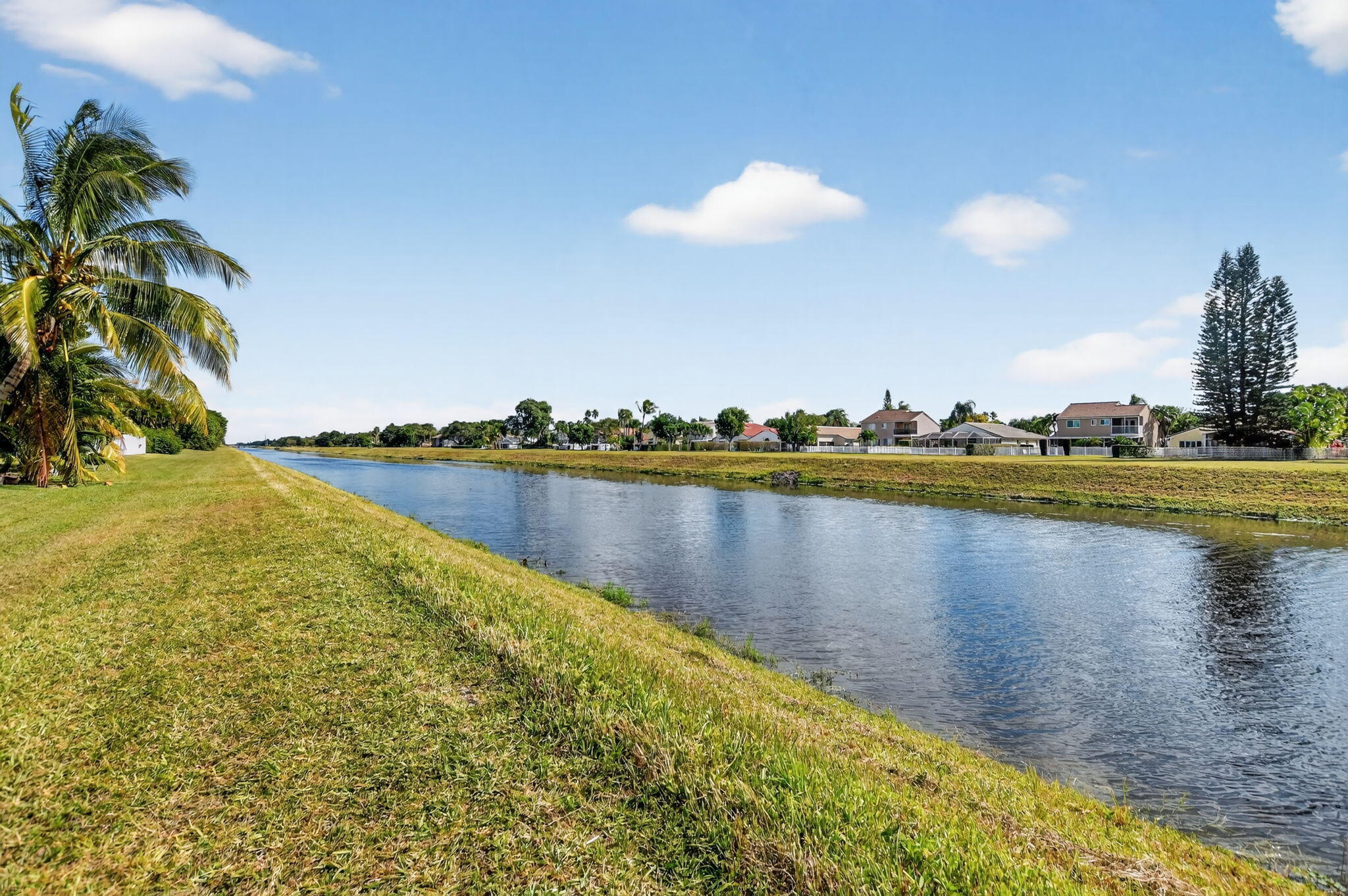 7816 Travelers Tree Drive Boca Raton, FL 33433 - Photo 50 of 61 a view of a lake with houses