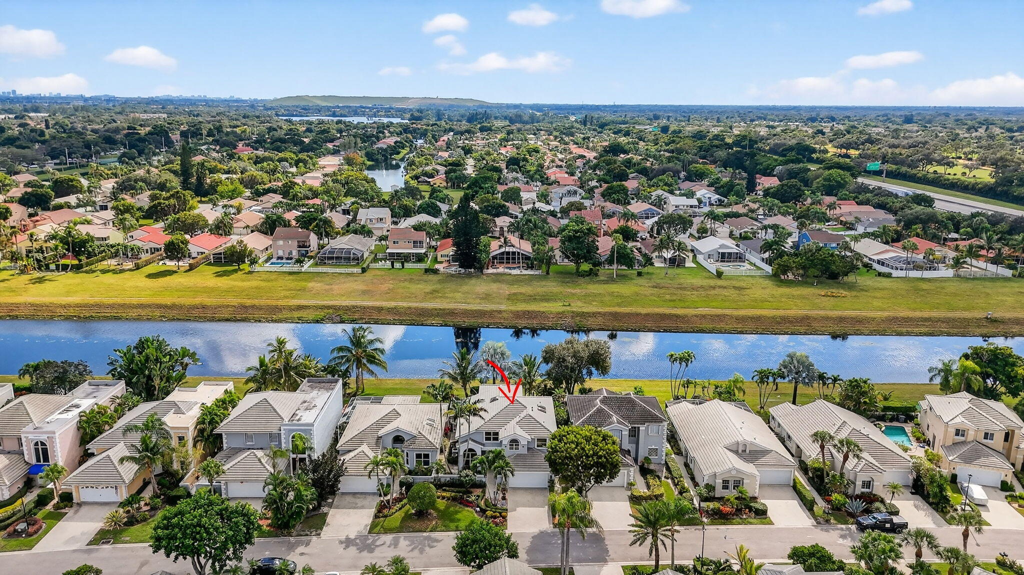 7816 Travelers Tree Drive Boca Raton, FL 33433 - Photo 53 of 61 an aerial view of a city with lots of residential buildings ocean and mountain view in back