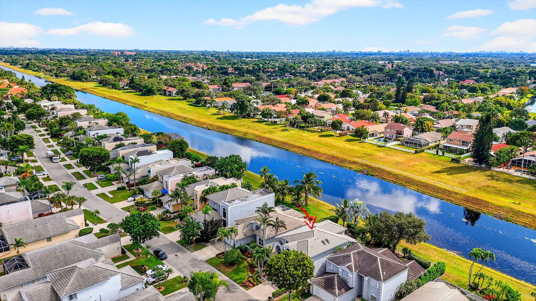 7816 Travelers Tree Drive Boca Raton, FL 33433 - Photo 54 of 61 an aerial view of a city with lots of residential buildings ocean and mountain view in back