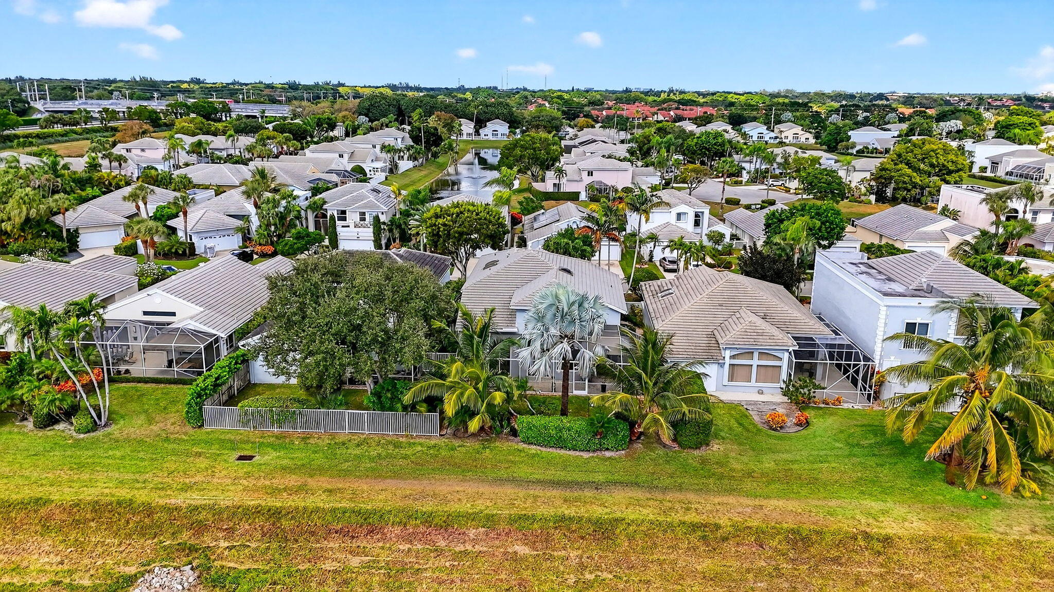 7816 Travelers Tree Drive Boca Raton, FL 33433 - Photo 58 of 61 an aerial view of residential houses with outdoor space and swimming pool