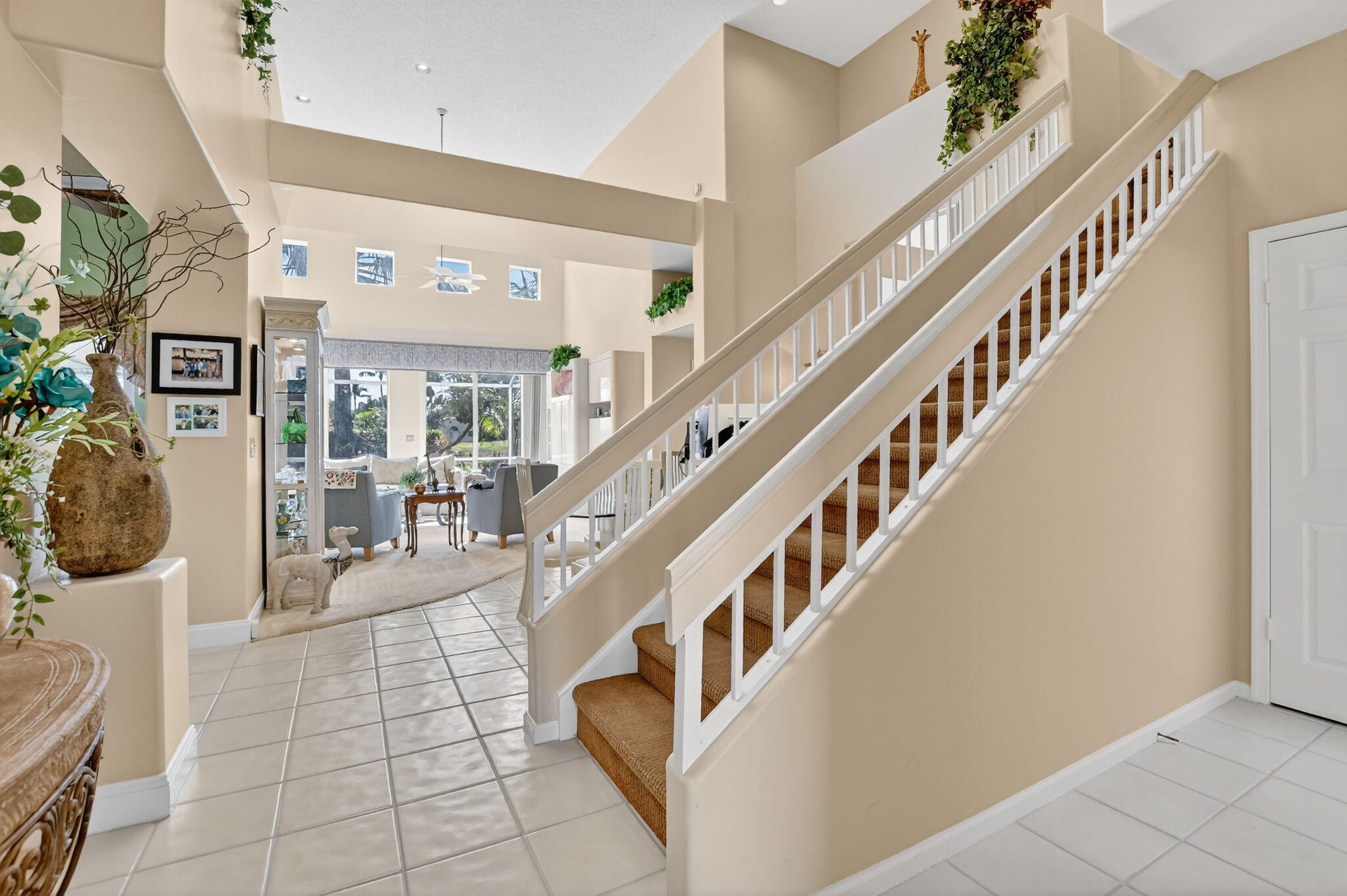 7816 Travelers Tree Drive Boca Raton, FL 33433 - Photo 6 of 61 a view of entryway and hall with dining room