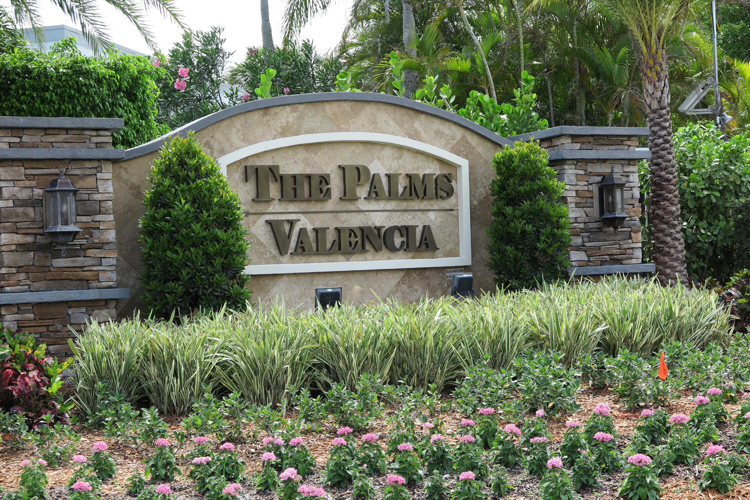 7816 Travelers Tree Drive Boca Raton, FL 33433 - Photo 61 of 61 a sign that is sitting in front of flowers