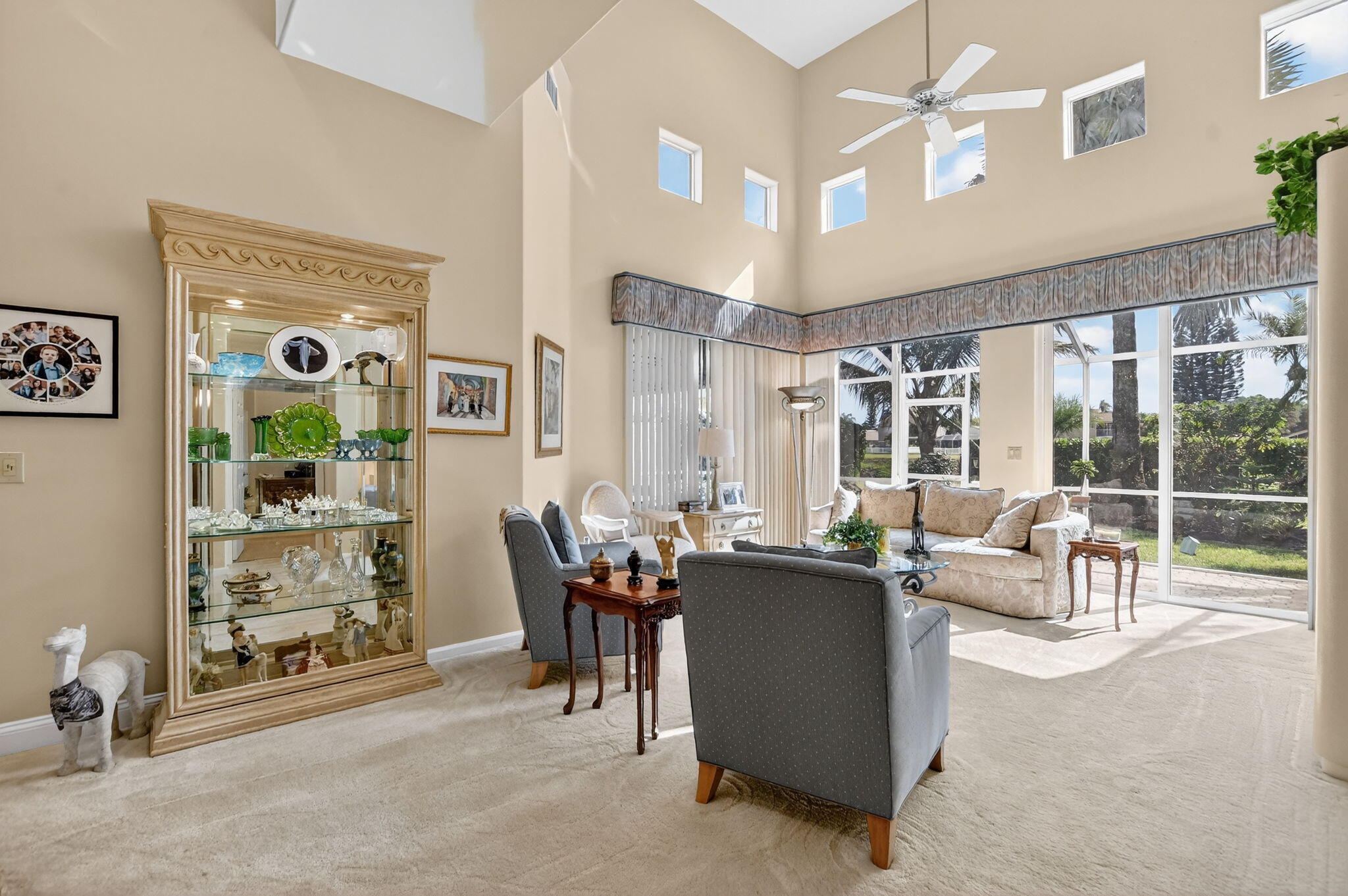 7816 Travelers Tree Drive Boca Raton, FL 33433 - Photo 7 of 61 a living room with furniture and a large window
