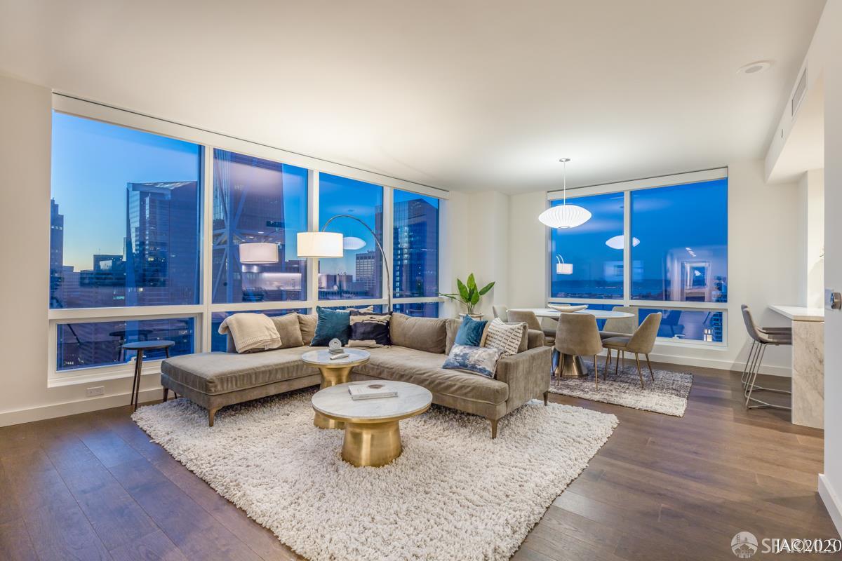 488 Folsom Street, Unit 4102 San Francisco, CA 94105 - Photo 12 of 46 a living room with furniture a rug and a large window