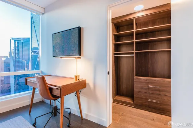 a room that has a dresser and a chair in it