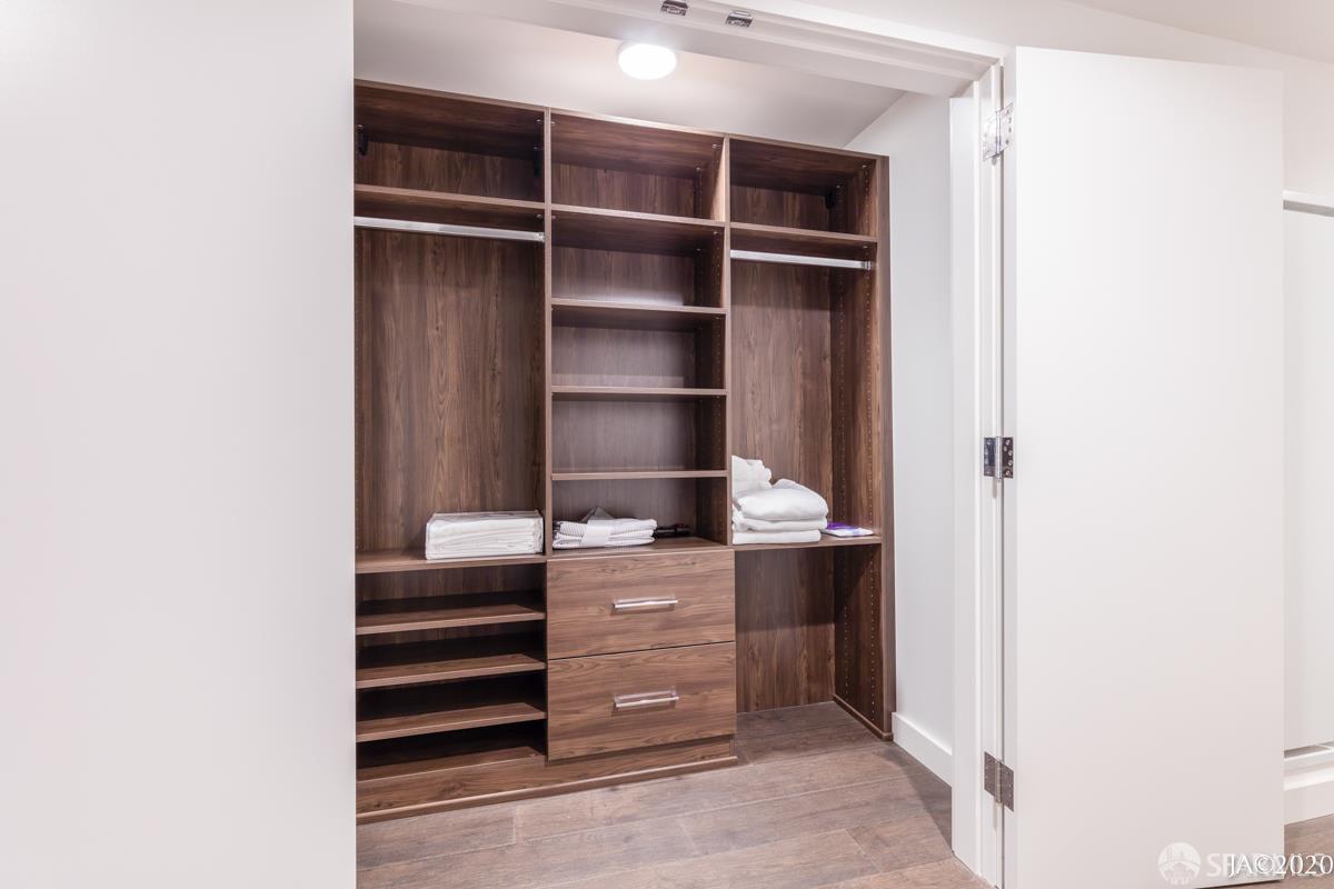 488 Folsom Street, Unit 4102 San Francisco, CA 94105 - Photo 43 of 46 a room with a furniture and wooden floor