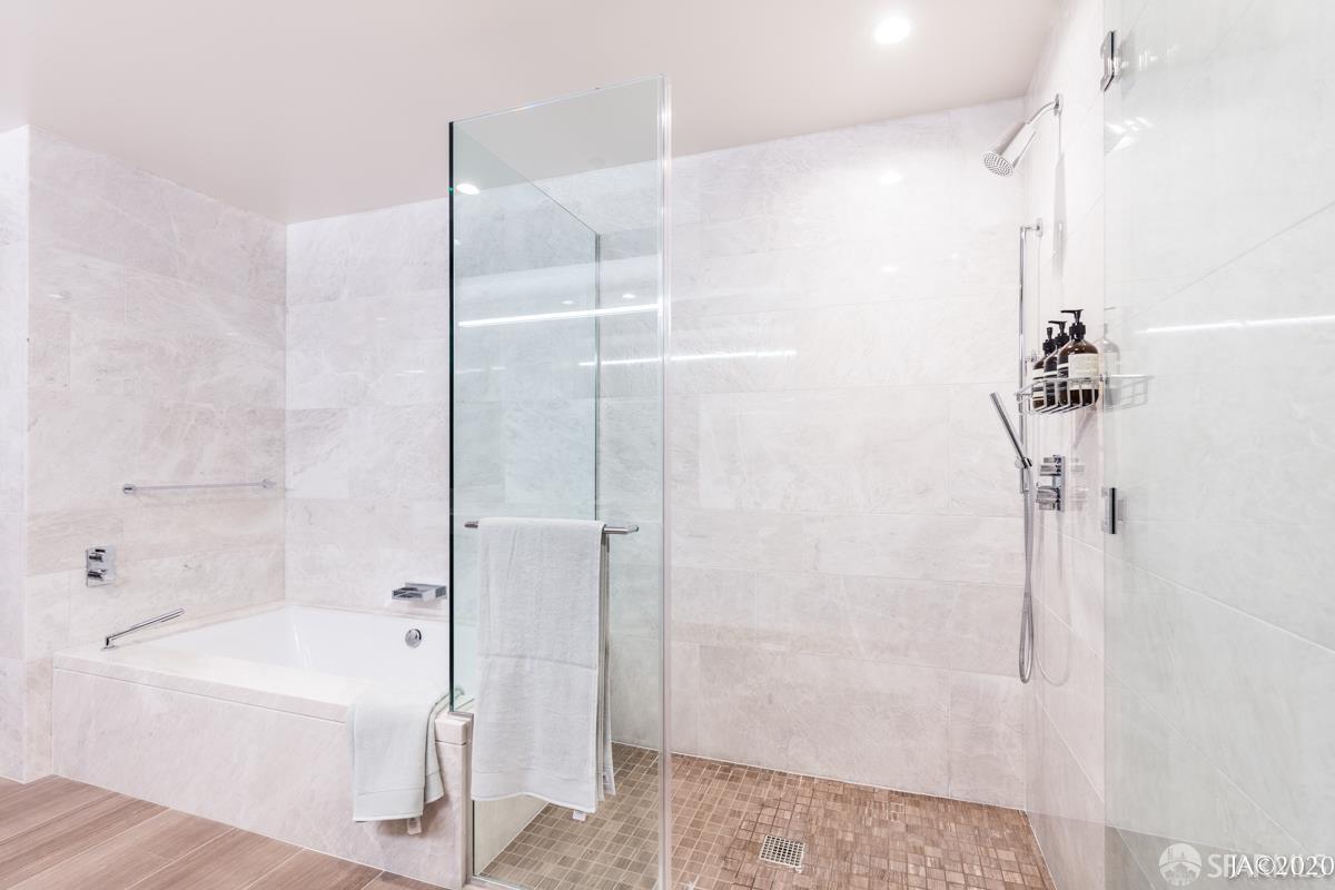 488 Folsom Street, Unit 4102 San Francisco, CA 94105 - Photo 6 of 46 a bathroom with a bathtub and a shower