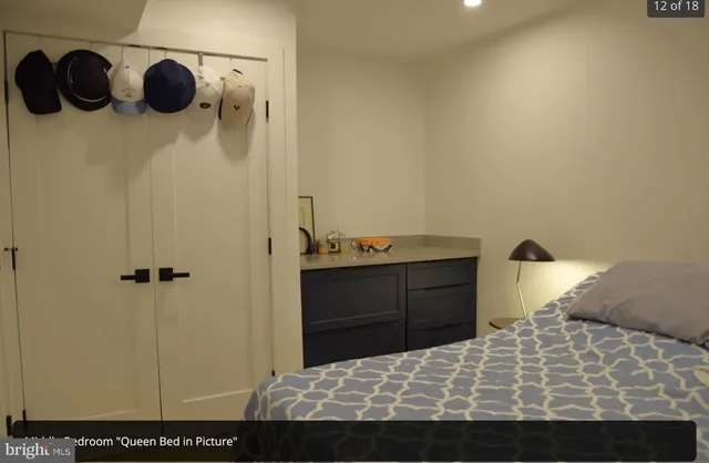 a bedroom with a bed and cabinets