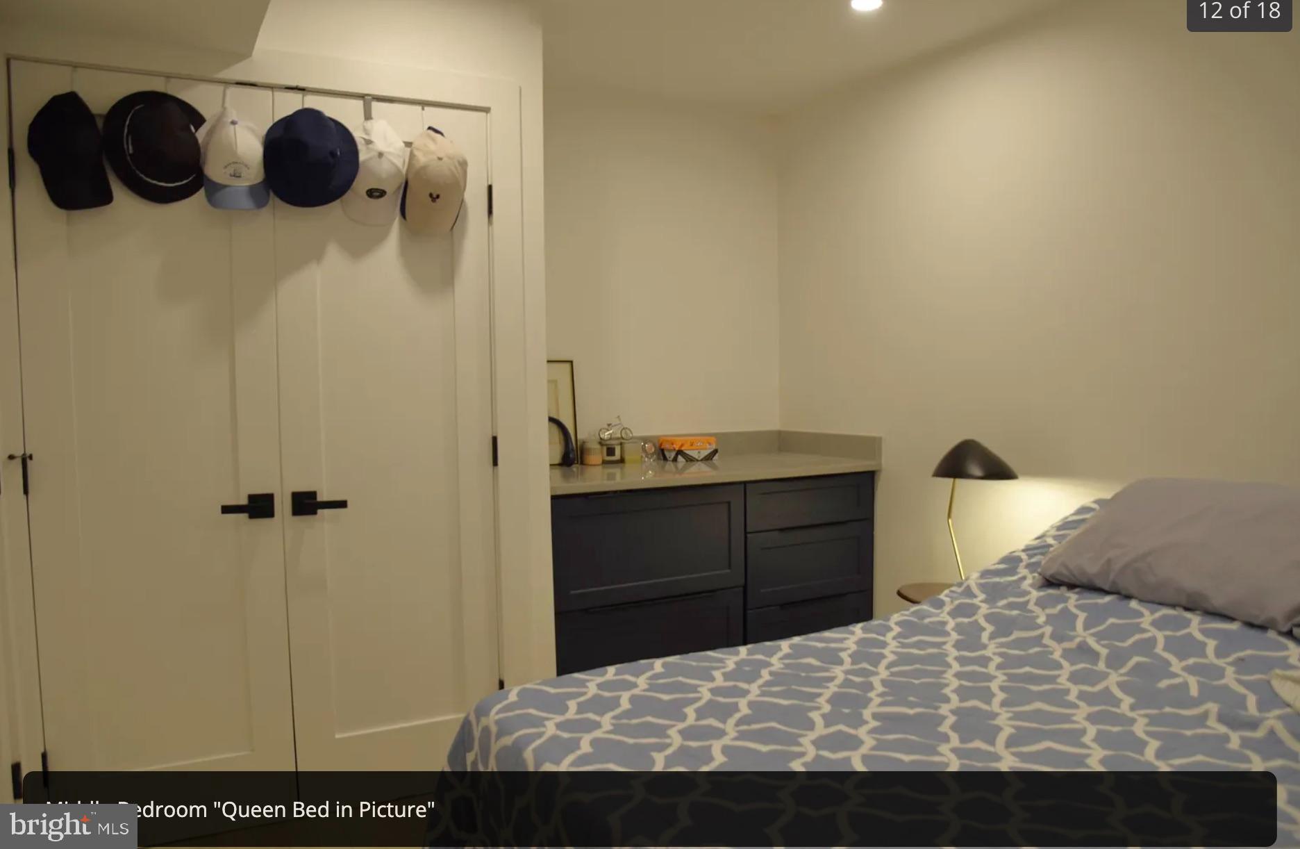 718 6th Street Northeast, Unit 1 Washington, DC 20002 - Photo 16 of 21 a bedroom with a bed and cabinets