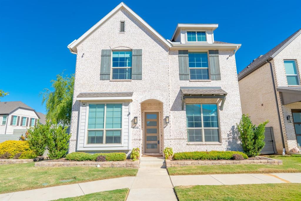 5306 Waterloo Drive Sachse, TX 75048 - Photo 1 of 1 a front view of a house with a yard and potted plants