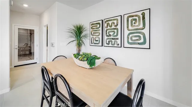 a view of a dining room with furniture and window