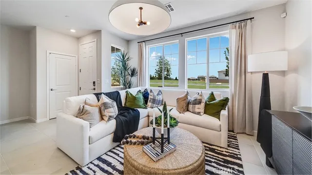 a living room with furniture and a large window