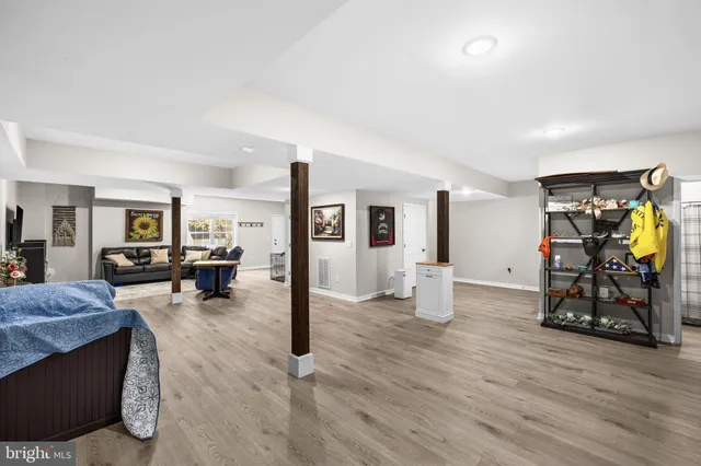 an empty room with wooden floor