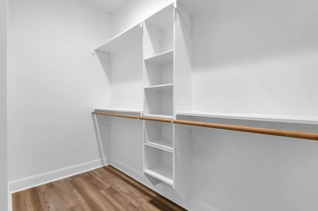 a view of an empty walk in closet