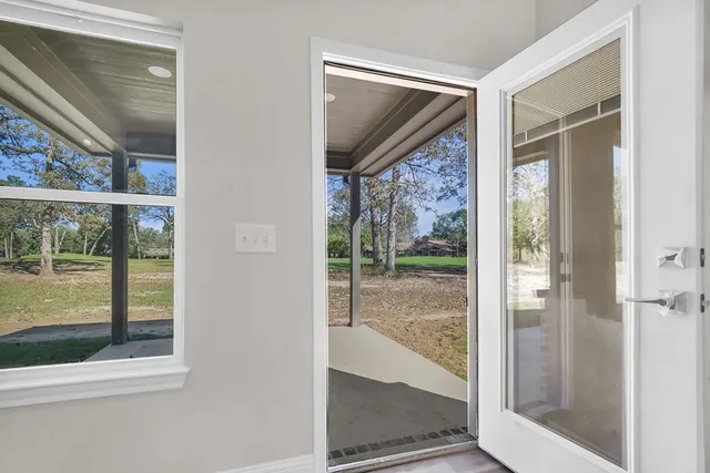 a view of a glass door of the house