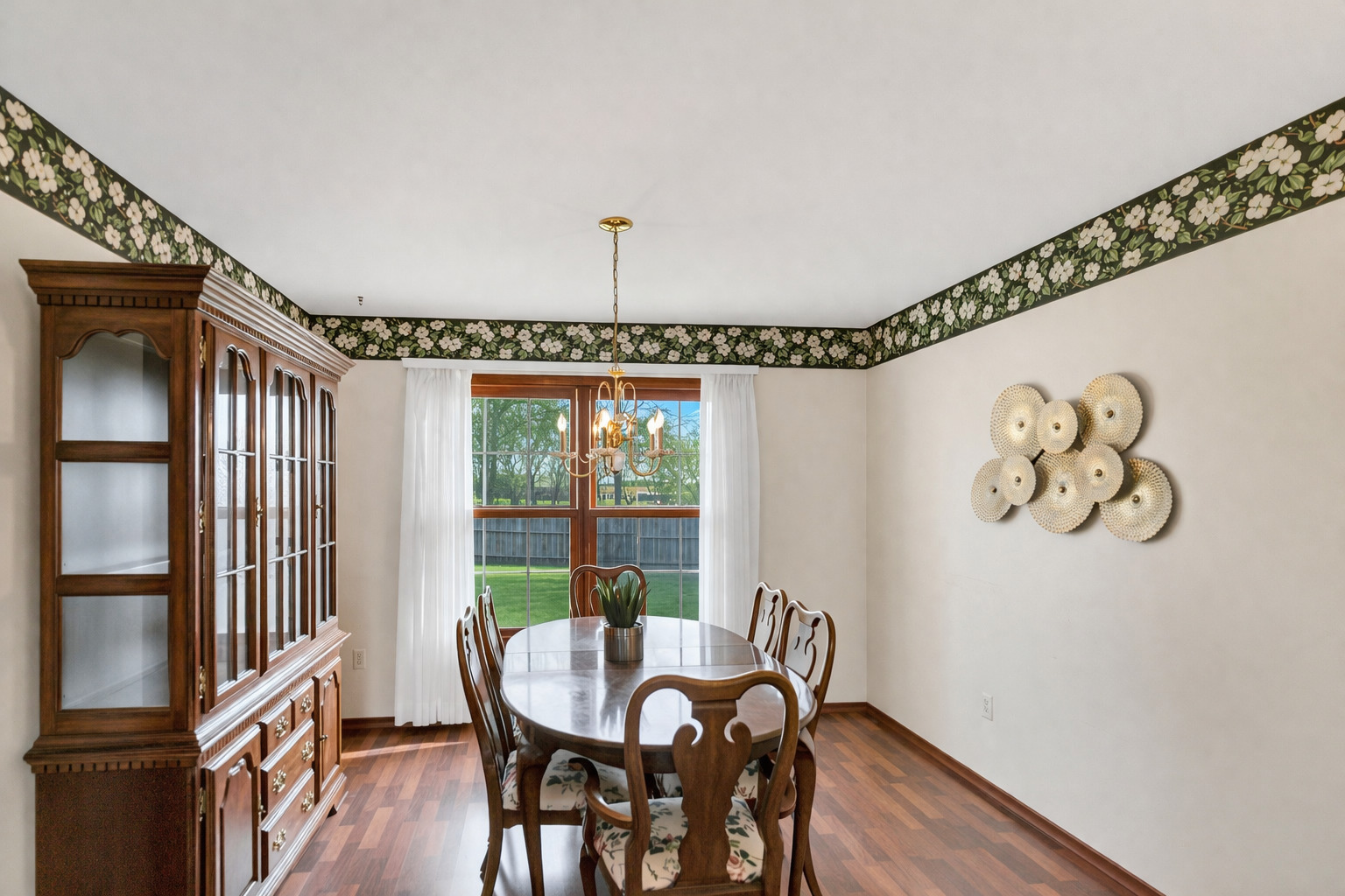 842 Pin Oak Circle Cary, IL 60013 - Photo 13 of 37 a view of a dining room with furniture window and wooden floor