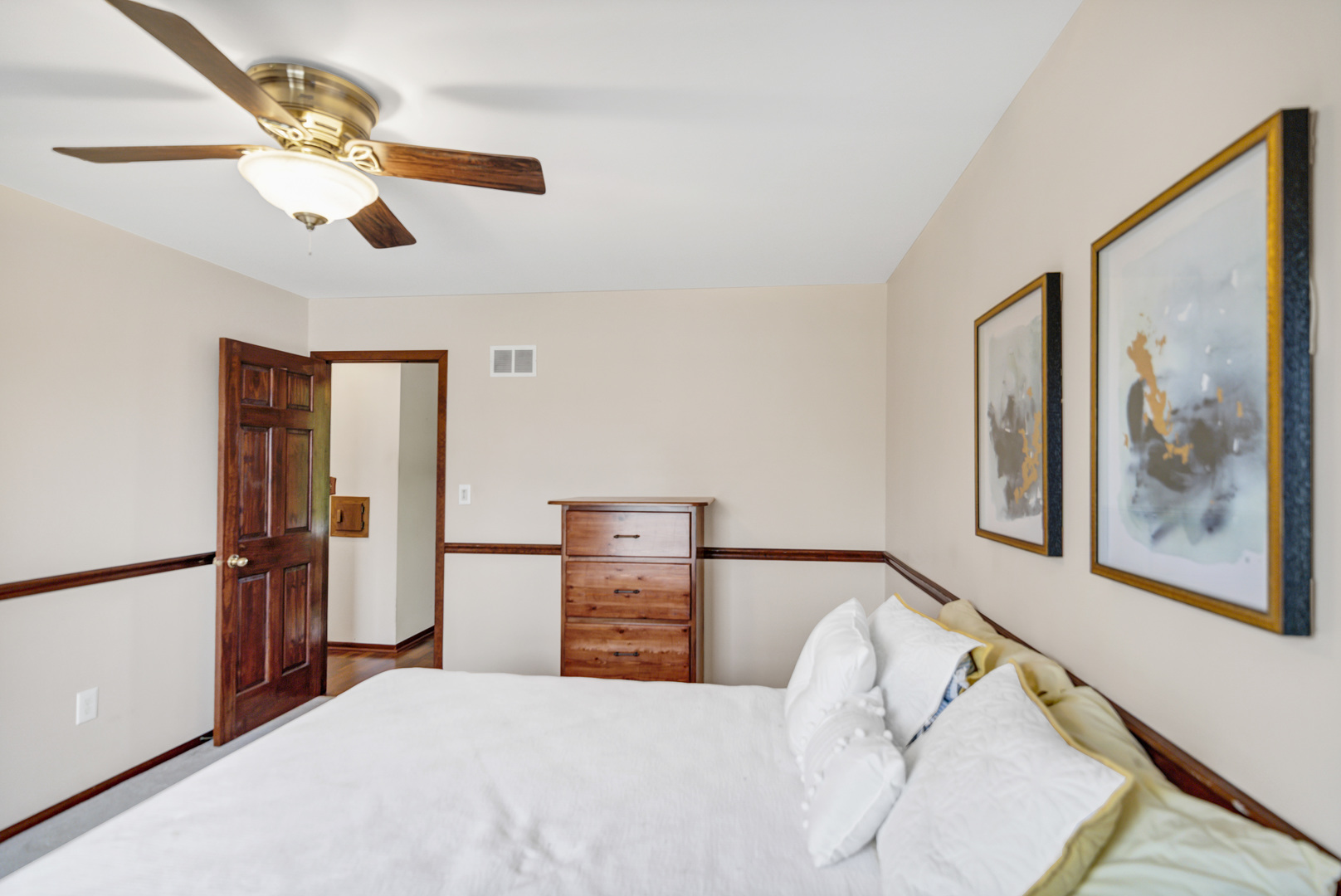 842 Pin Oak Circle Cary, IL 60013 - Photo 18 of 37 a bedroom with a bed and a painting on the wall