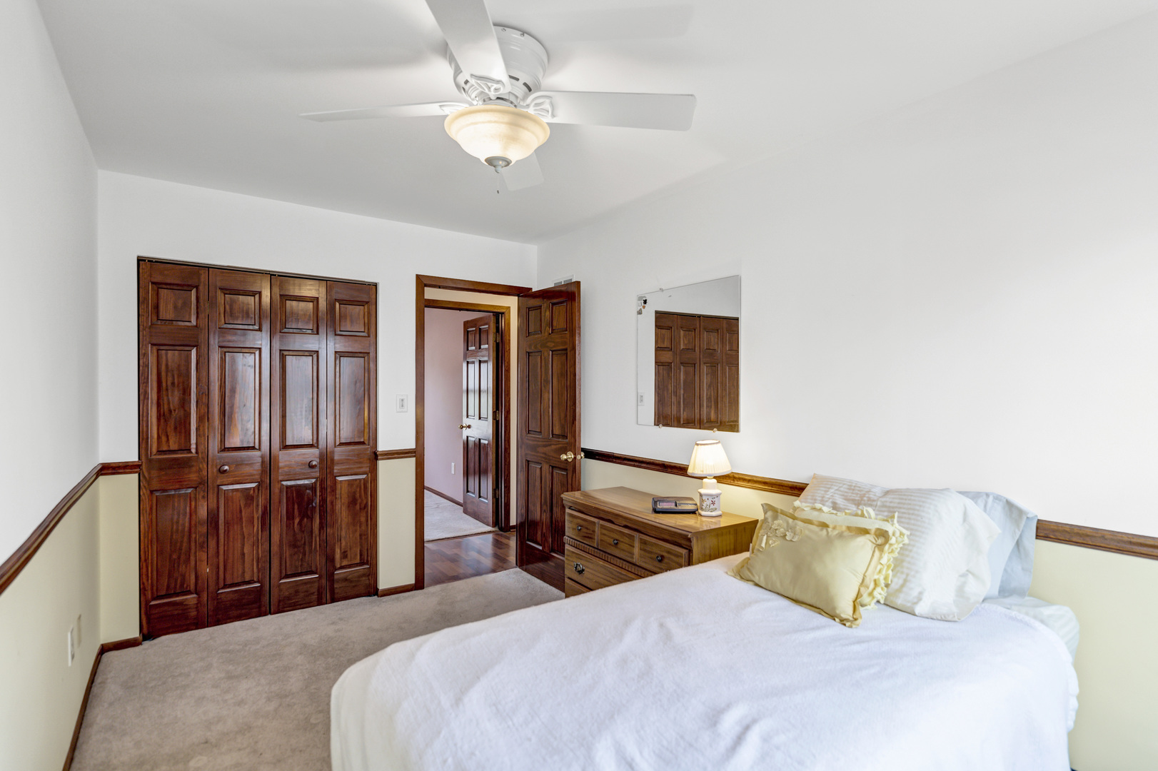 842 Pin Oak Circle Cary, IL 60013 - Photo 20 of 37 a bedroom with a bed and wooden floor