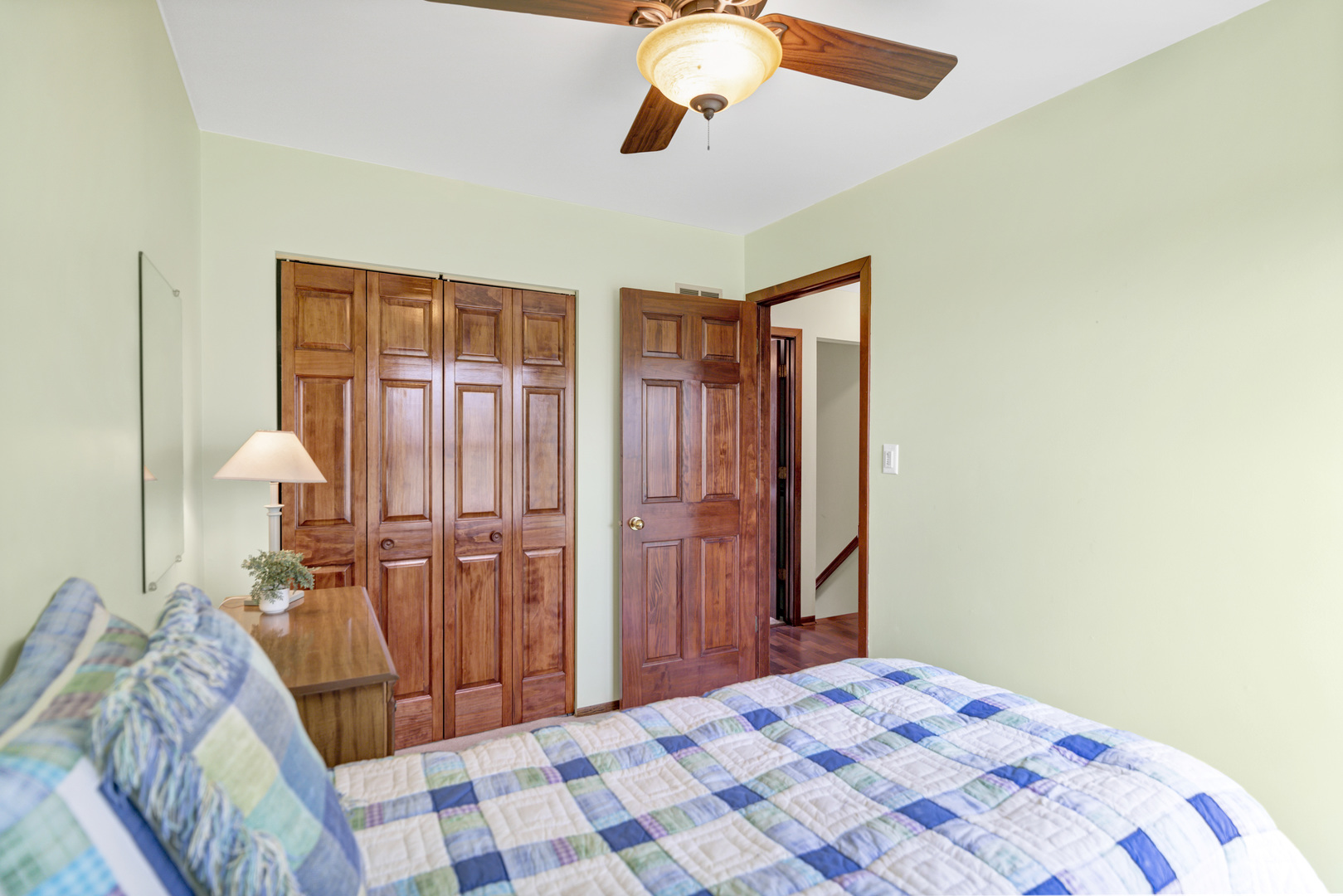 842 Pin Oak Circle Cary, IL 60013 - Photo 23 of 37 a bedroom with a bed and a chandelier
