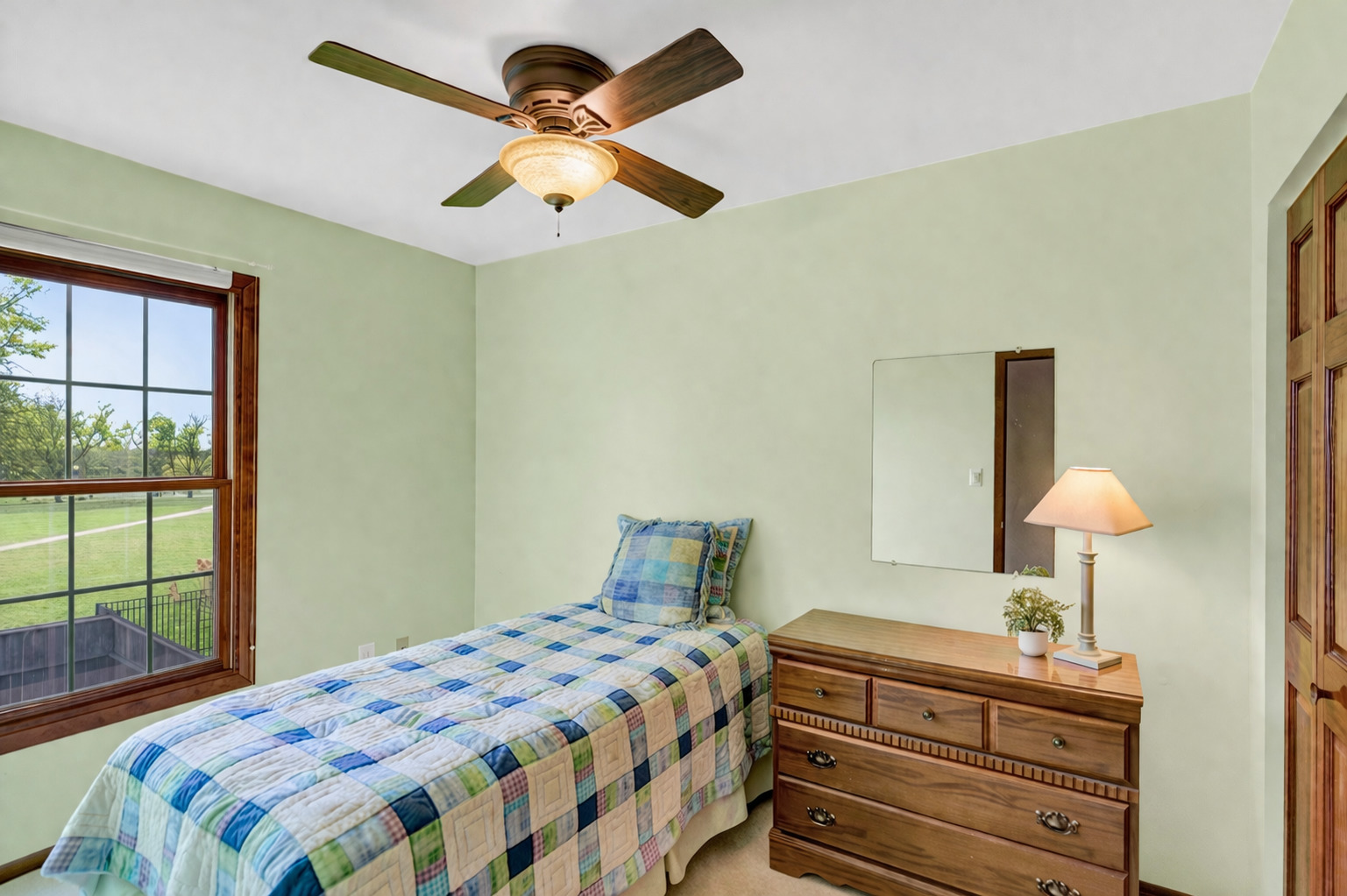 842 Pin Oak Circle Cary, IL 60013 - Photo 24 of 37 a bedroom with a bed and a lamp on dresser