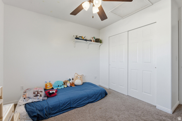 11189 Ohenry Road East Sandy, UT 84070 - Photo 19 of 44 Neutral wall finishes with a ceiling fan light fixture, carpeted flooring, and a built-in shelf