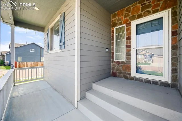 a view of porch with a bench