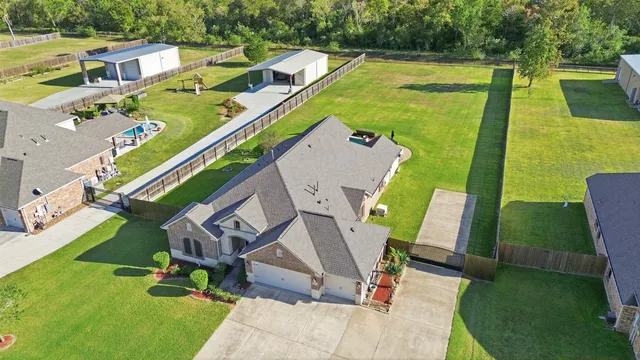 an aerial view of a house with a swimming pool
