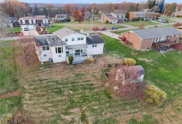 an aerial view of a house with a garden