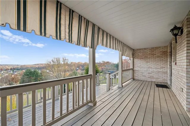 a view of balcony with wooden floor