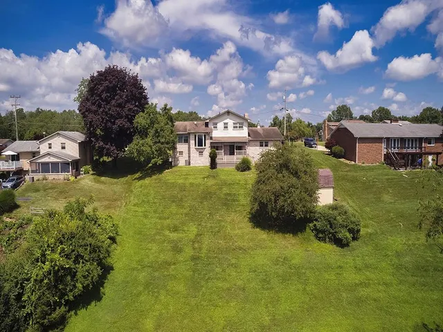 a view of a house with a big yard