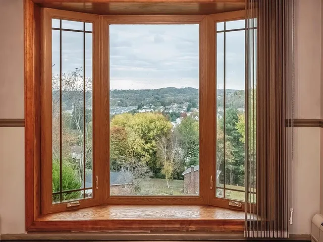 a view of a room that has a large window