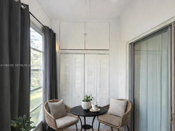 a view of a livingroom with furniture and window