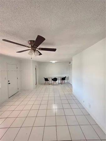 a view of an empty room and a window