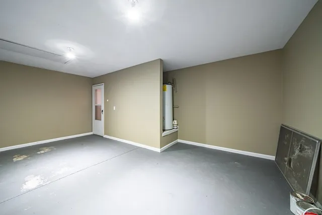 an empty room with a empty space and a window