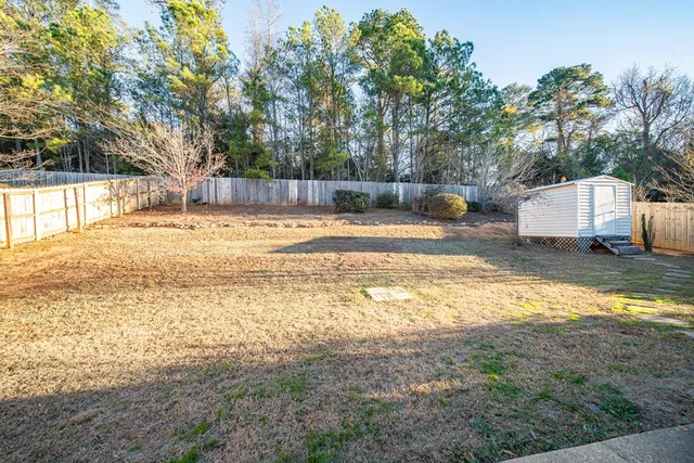 a view of a yard with swimming pool