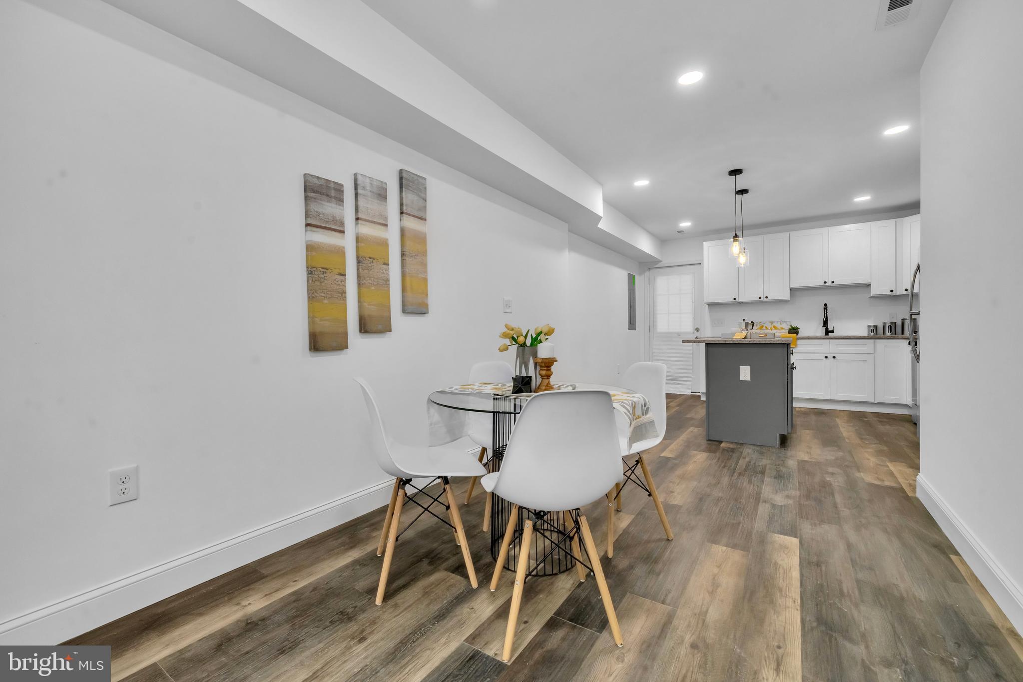 1710 Light Street Baltimore, MD 21230 - Photo 14 of 59 a view of a dining room with furniture and wooden floor