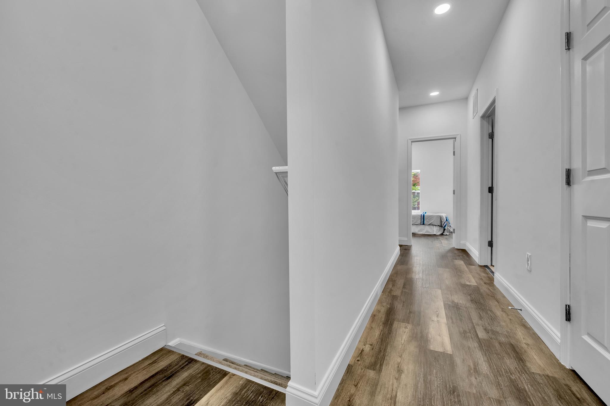 1710 Light Street Baltimore, MD 21230 - Photo 26 of 59 a view of a hallway with wooden floor