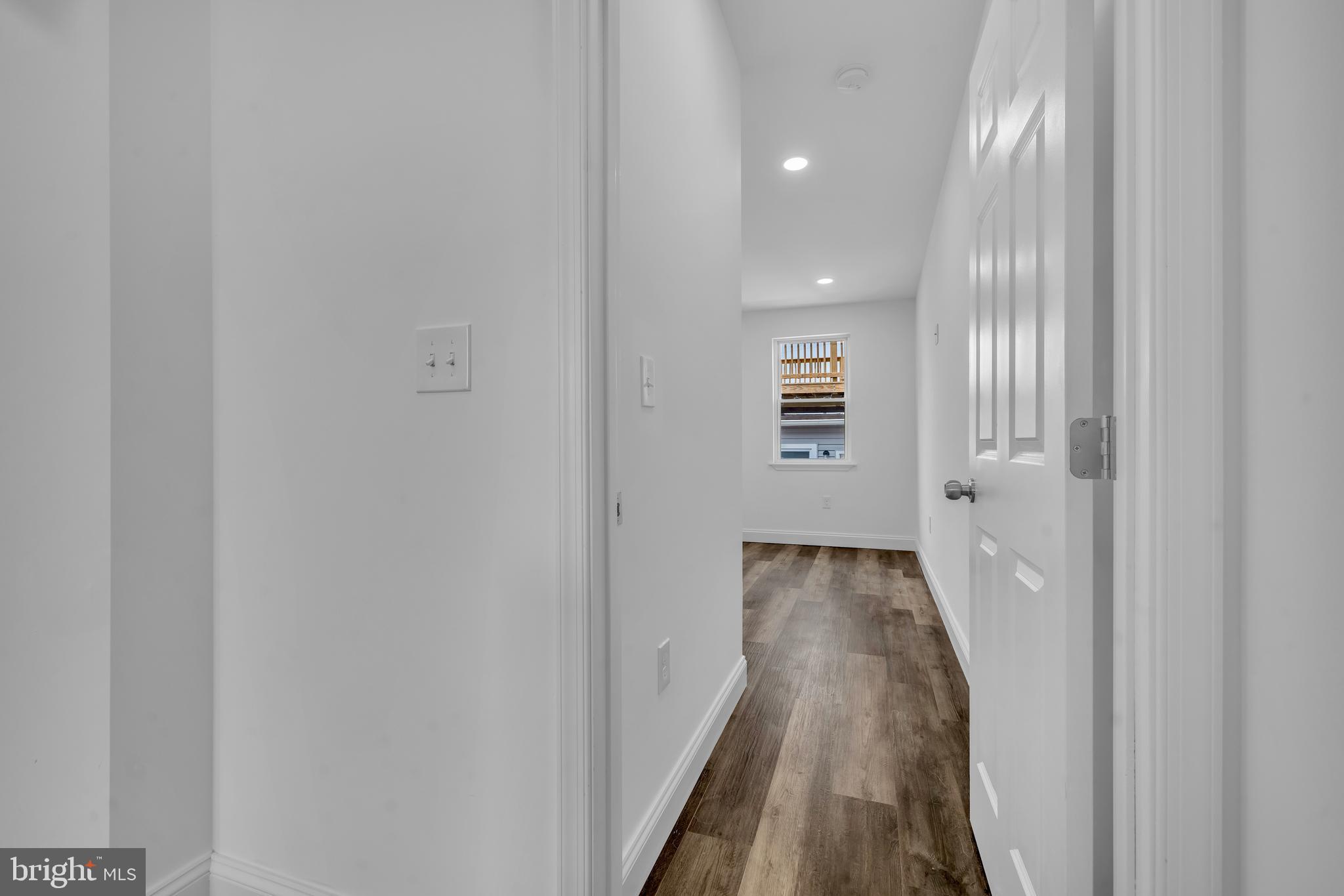 1710 Light Street Baltimore, MD 21230 - Photo 32 of 59 a view of a hallway with wooden floor