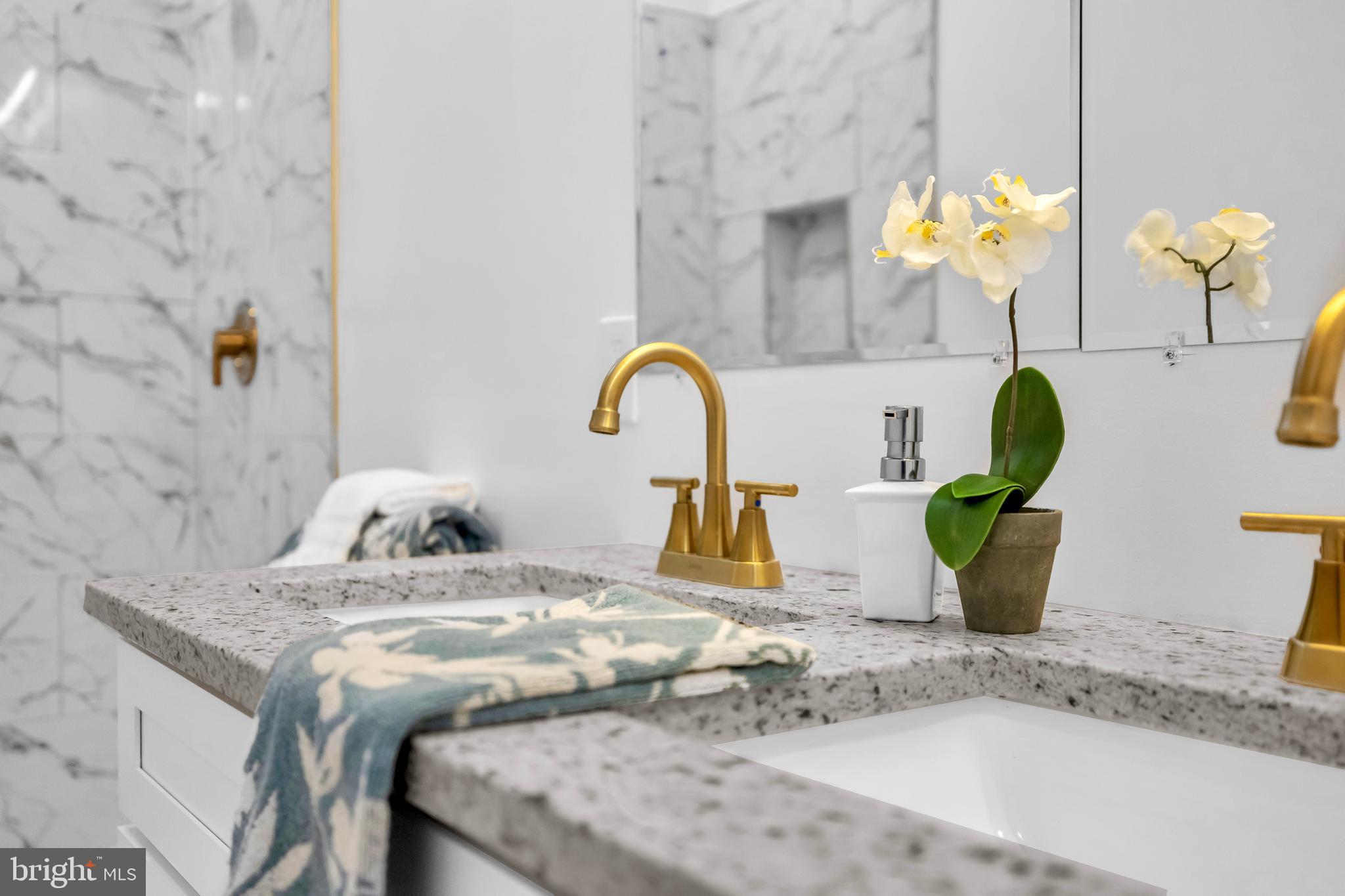 1710 Light Street Baltimore, MD 21230 - Photo 36 of 59 a kitchen view with granite countertop a sink a window and potted plants