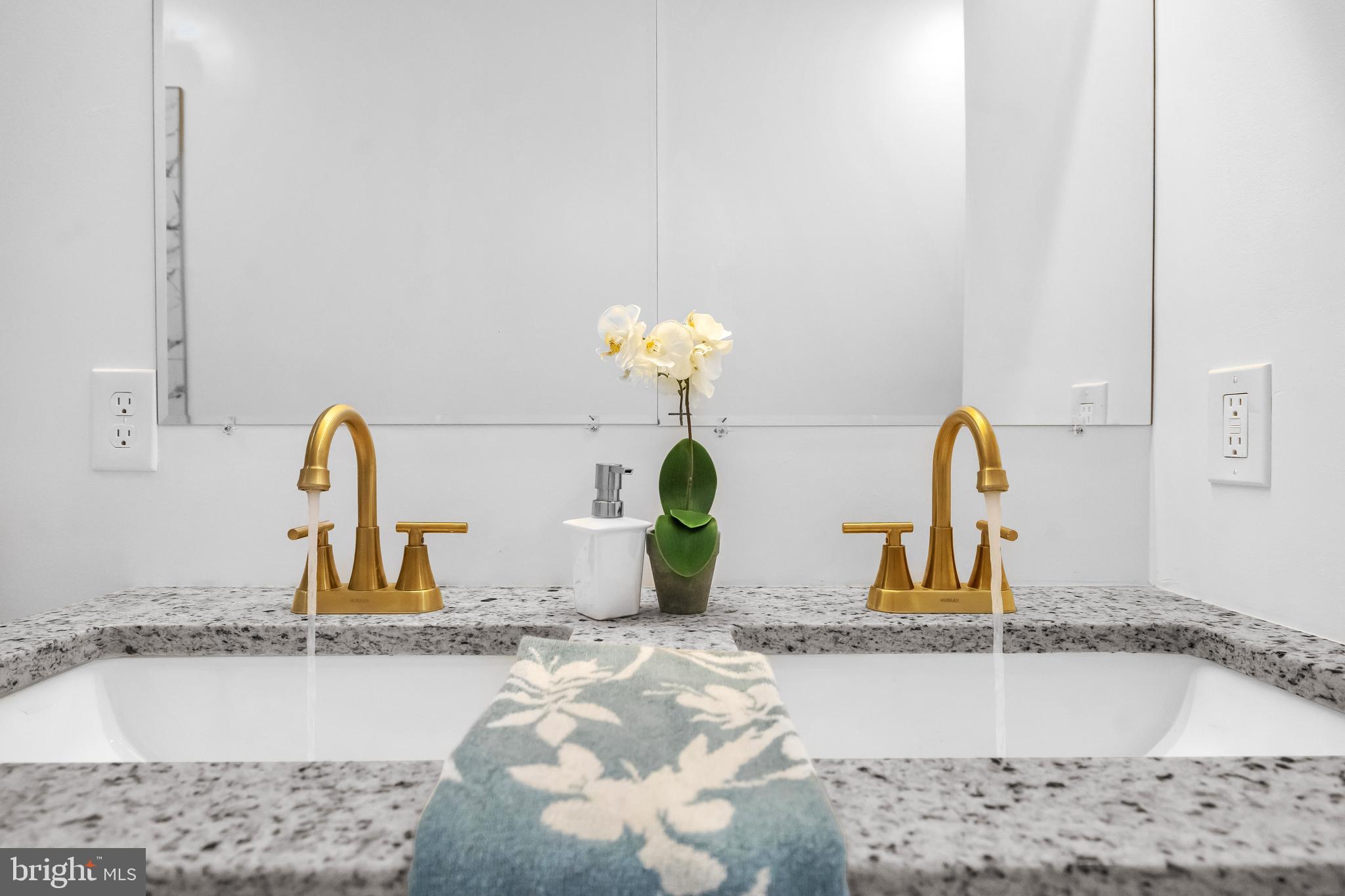 1710 Light Street Baltimore, MD 21230 - Photo 37 of 59 a bathroom with a sink and a mirror