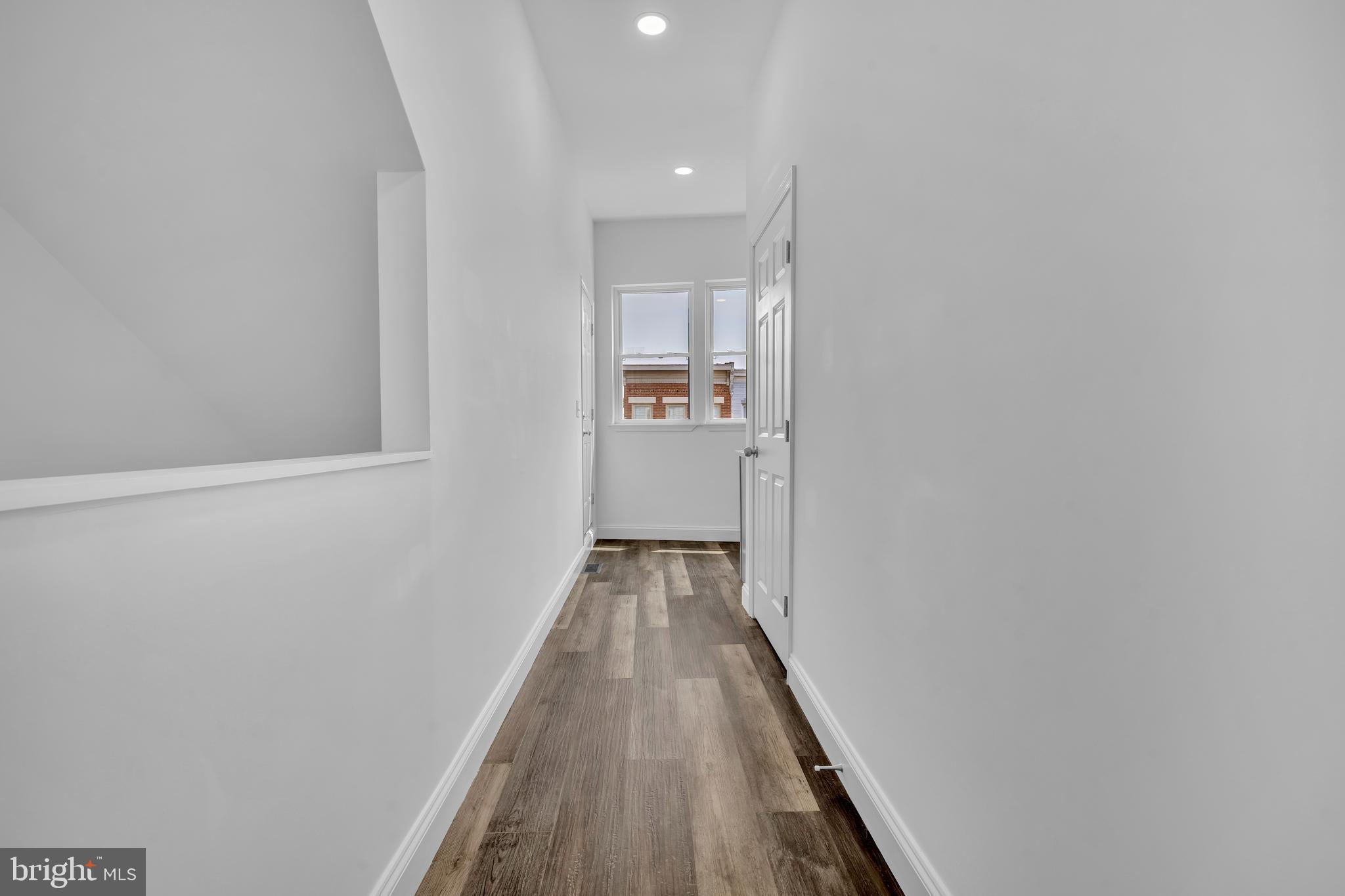 1710 Light Street Baltimore, MD 21230 - Photo 39 of 59 a view of a hallway with wooden floor