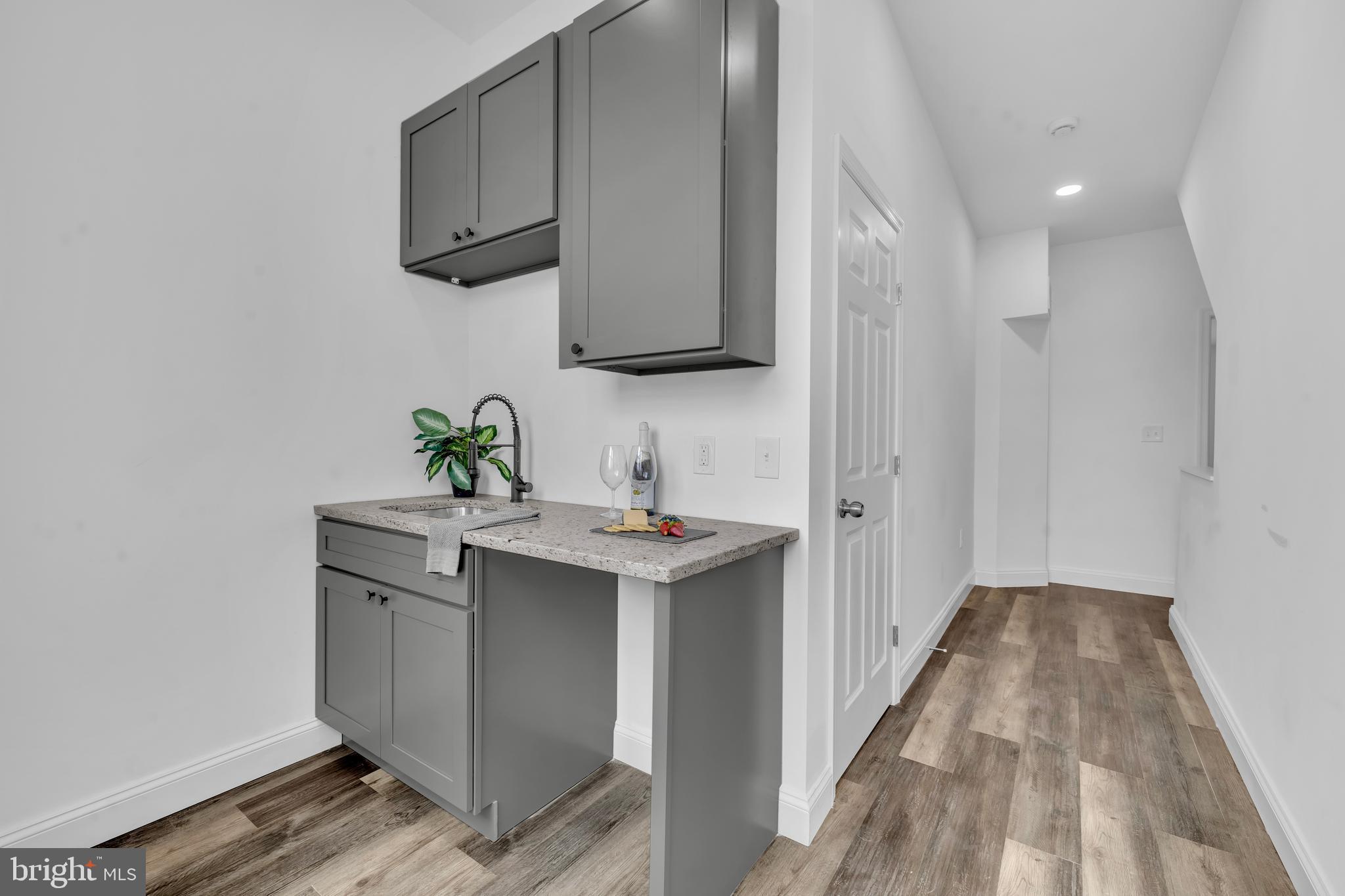 1710 Light Street Baltimore, MD 21230 - Photo 42 of 59 a bathroom with a sink and a mirror