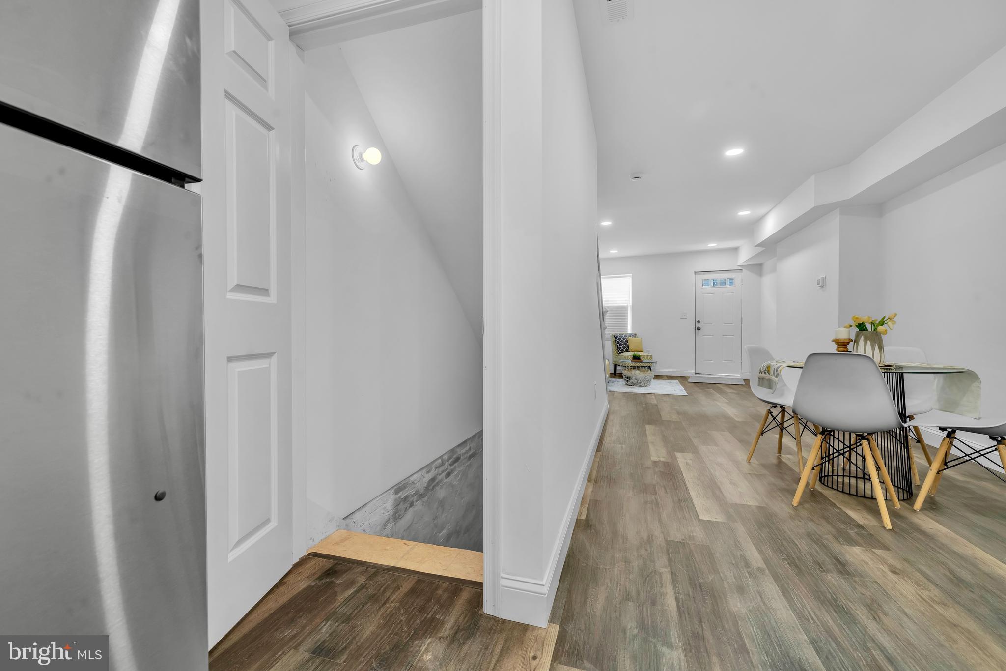 1710 Light Street Baltimore, MD 21230 - Photo 49 of 59 a view of a hallway with wooden floor and furniture